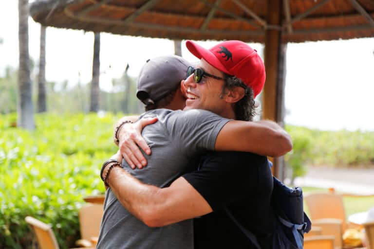 9_Attendees+Hugging_Lobby2018